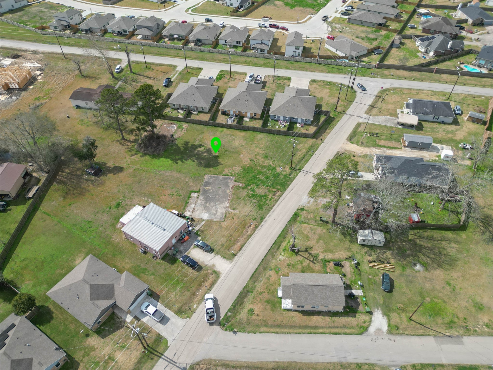 0 West Linney Street Dayton, TX 77535 - Photo 6 of 6 an aerial view of a house with outdoor space and lake view