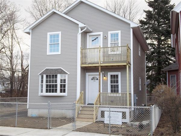 75 Tyler Street Springfield, MA 01109 - Photo 1 of 14 a front view of a house with a porch