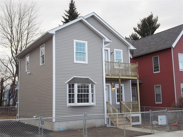 75 Tyler Street Springfield, MA 01109 - Photo 2 of 14 a front view of a house with glass windows