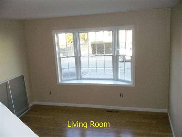 75 Tyler Street Springfield, MA 01109 - Photo 4 of 14 a view of an empty room with a window
