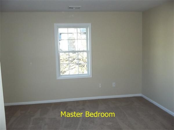 75 Tyler Street Springfield, MA 01109 - Photo 7 of 14 an empty room with a window