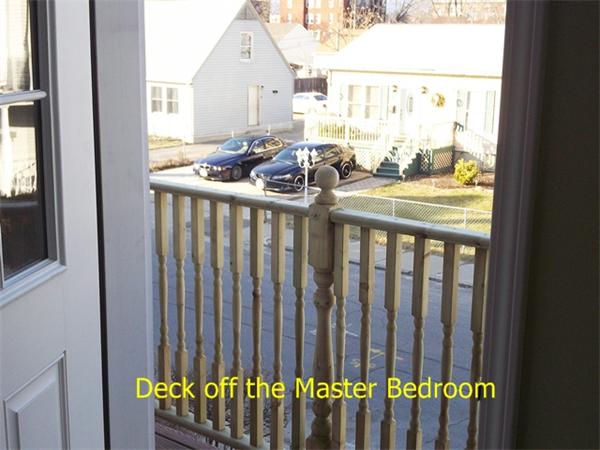 75 Tyler Street Springfield, MA 01109 - Photo 8 of 14 a view of a porch with wooden floor