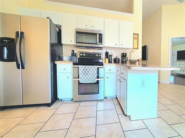 a view of a hallway with wooden shelves