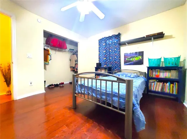 a bedroom with furniture and a window