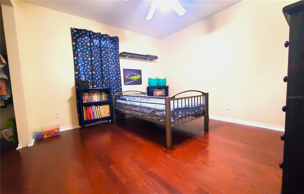 13599 Southeast 51st Terrace Summerfield, FL 34491 - Photo 16 of 44 a bedroom with furniture and a window