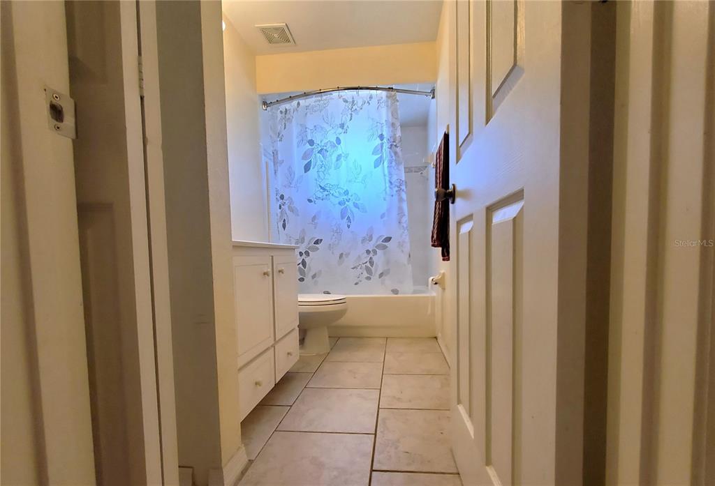 13599 Southeast 51st Terrace Summerfield, FL 34491 - Photo 18 of 44 a bathroom with a tub and shower