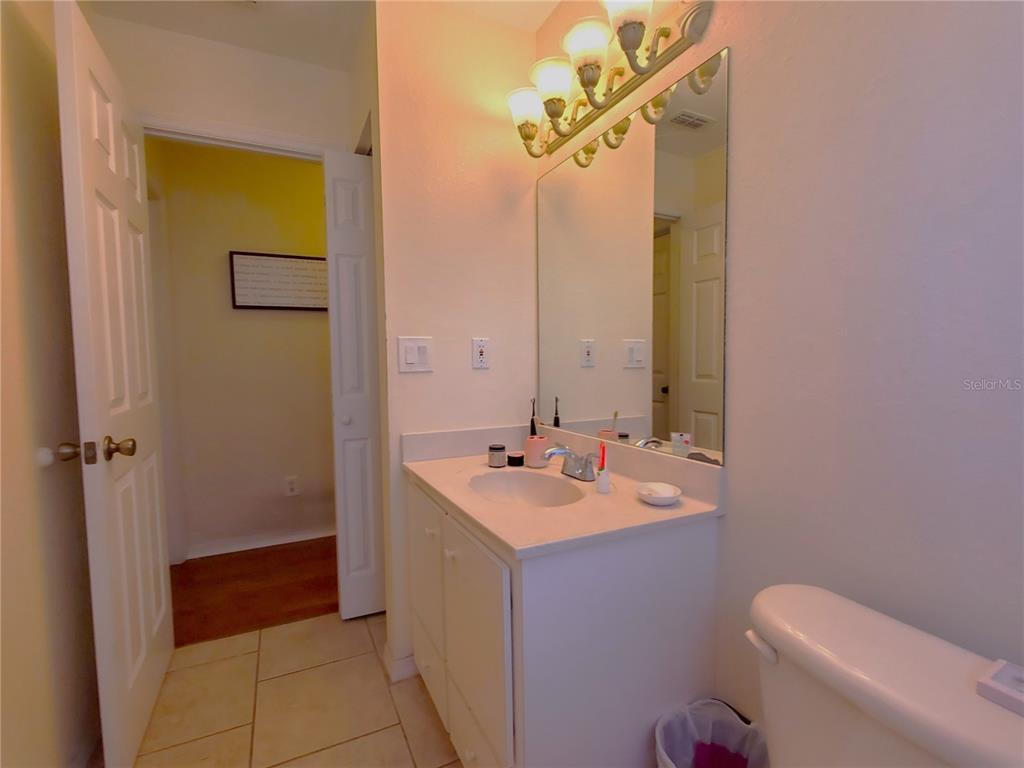 13599 Southeast 51st Terrace Summerfield, FL 34491 - Photo 19 of 44 a bathroom with a sink a toilet and shower