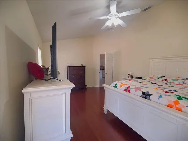 a bed room with a bed and a television