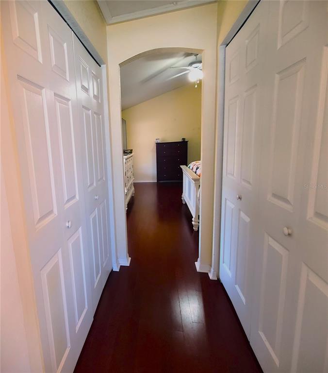 13599 Southeast 51st Terrace Summerfield, FL 34491 - Photo 26 of 44 a view of a hallway with wooden floor and closet area