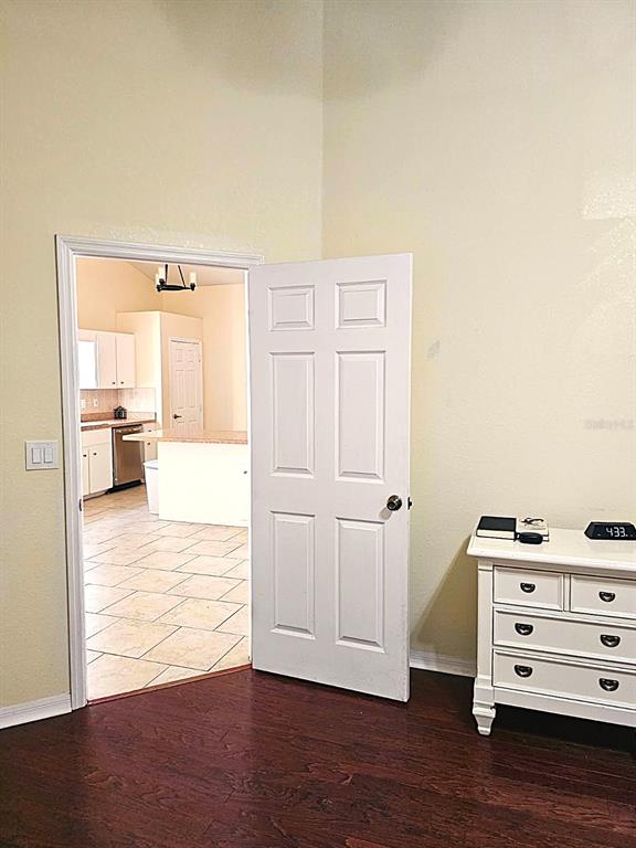 13599 Southeast 51st Terrace Summerfield, FL 34491 - Photo 42 of 44 a view of kitchen with livingroom and hardwood floor
