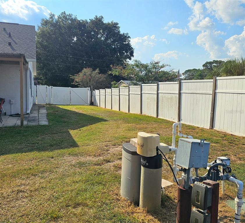 13599 Southeast 51st Terrace Summerfield, FL 34491 - Photo 5 of 44 a view of a backyard with fountain plants