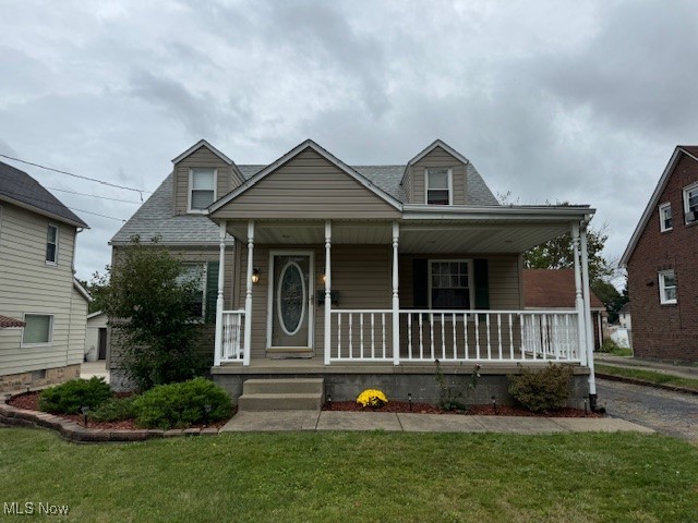 520 8th Street Struthers, OH 44471 - Photo 1 of 22 View of front of house with a front lawn and covered porch