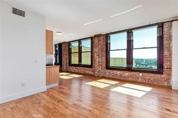 a kitchen with stainless steel appliances a refrigerator and a stove top oven