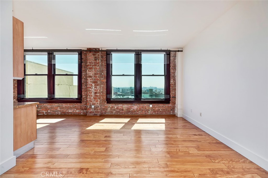 460 South Spring Street, Unit 802 Los Angeles, CA 90013 - Photo 13 of 25 a view of an empty room with glass door