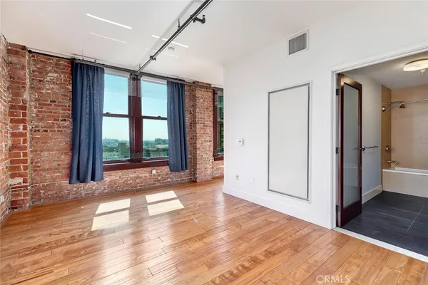 a view of a room with a large window