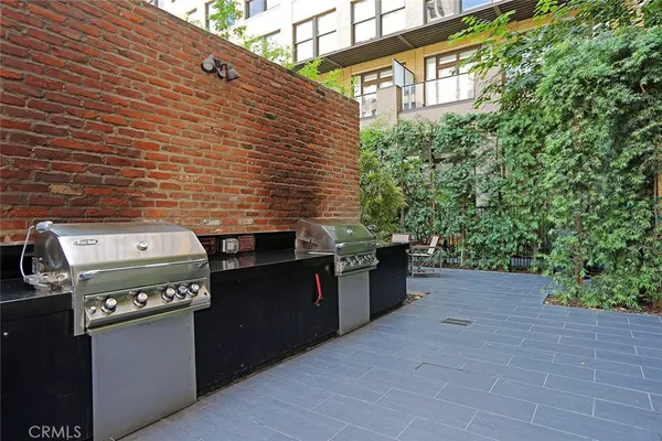 a backyard of a house with stainless steel appliances