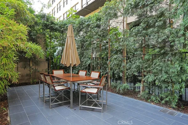 a view of a chairs and table in the patio