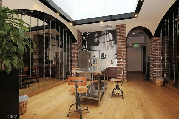 a living room with fireplace furniture and a flat screen tv