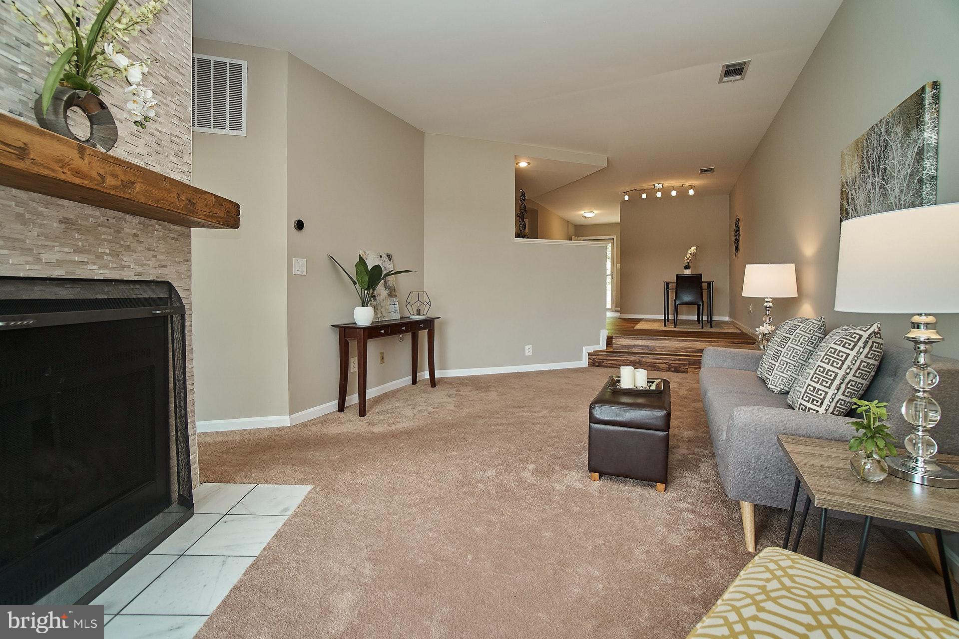 11180 Harbor Court Reston, VA 20191 - Photo 5 of 22 Living Room Featuring Updated Fireplace