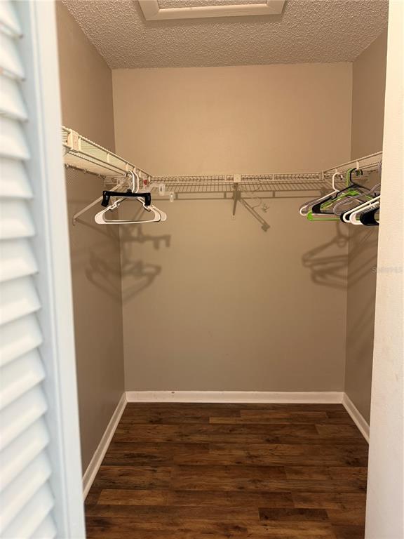 1236 Pine Ridge Circle West, Unit G3 Tarpon Springs, FL 34688 - Photo 12 of 18 a view of a room with racks on the wall