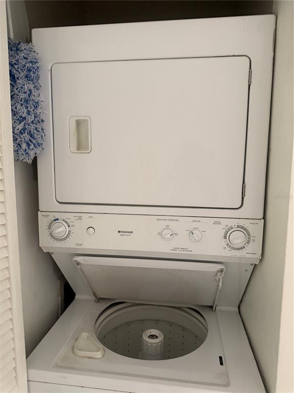 1236 Pine Ridge Circle West, Unit G3 Tarpon Springs, FL 34688 - Photo 14 of 18 a utility room with dryer and washer