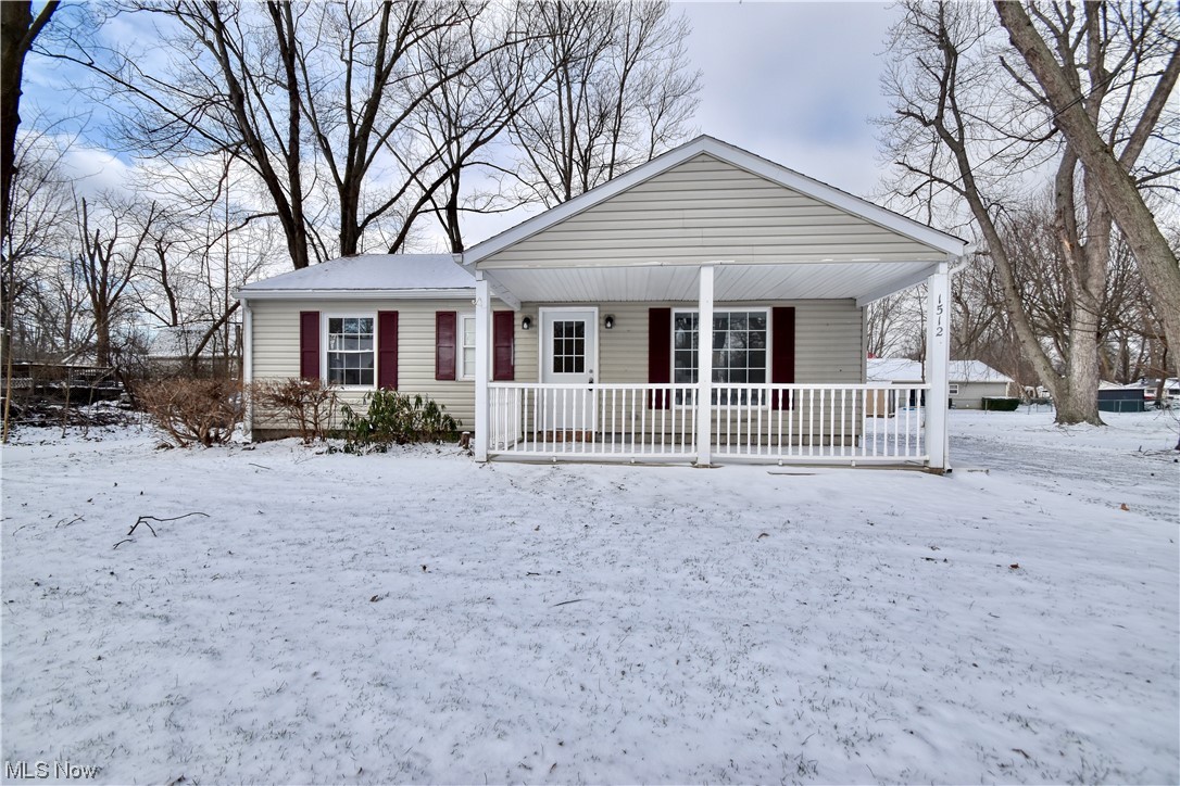 1512 Hubbard Road Madison, OH 44057 - Photo 2 of 27 View of front of property featuring covered porch