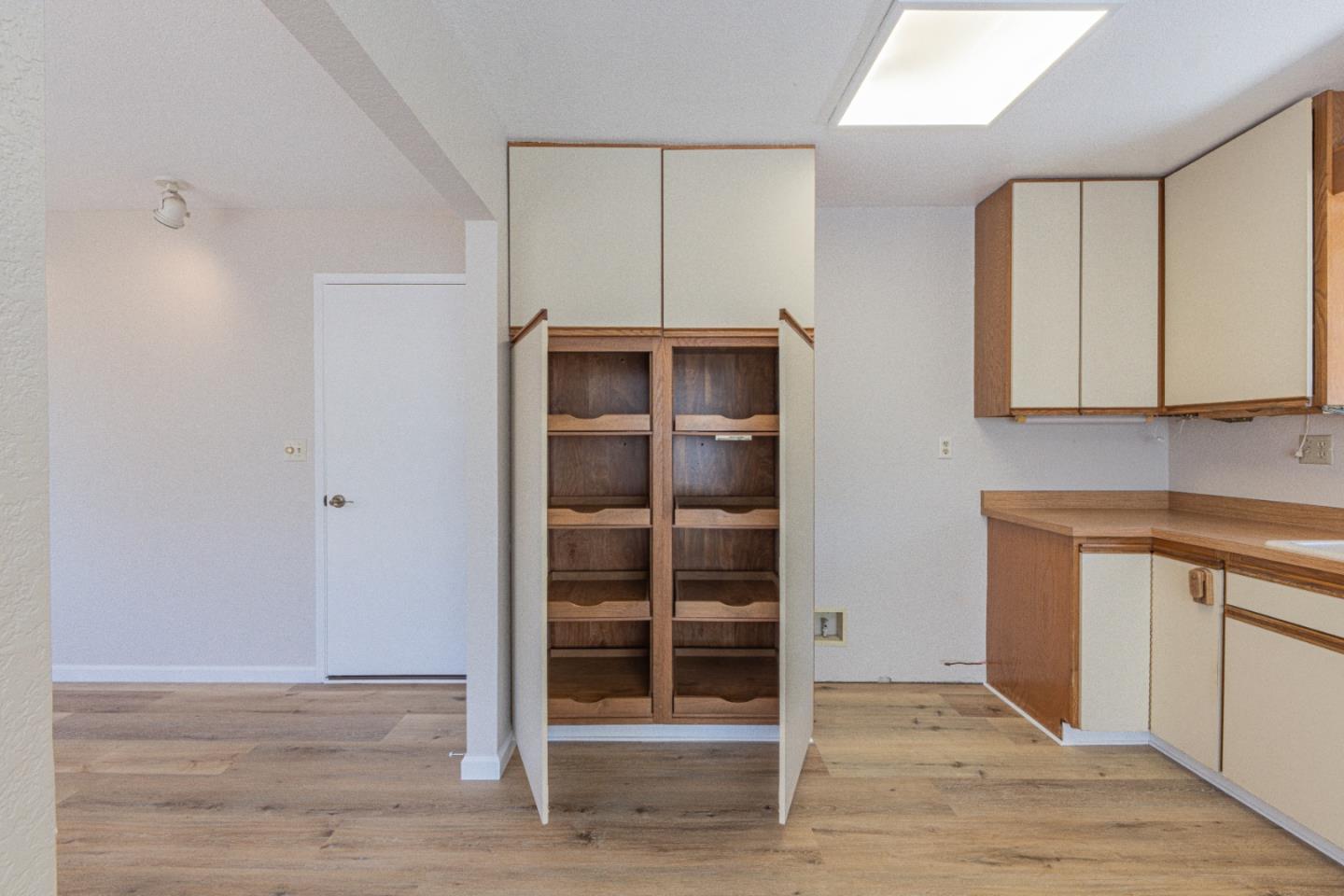 6959 Valle Pacifico Road Salinas, CA 93907 - Photo 18 of 45 a view of a room with wooden floor and cabinet