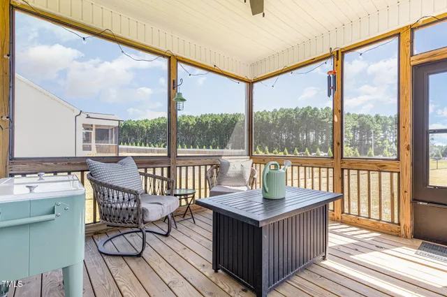 a view of a house with swimming pool and sitting area