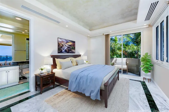 a bedroom with a bed and glass windows