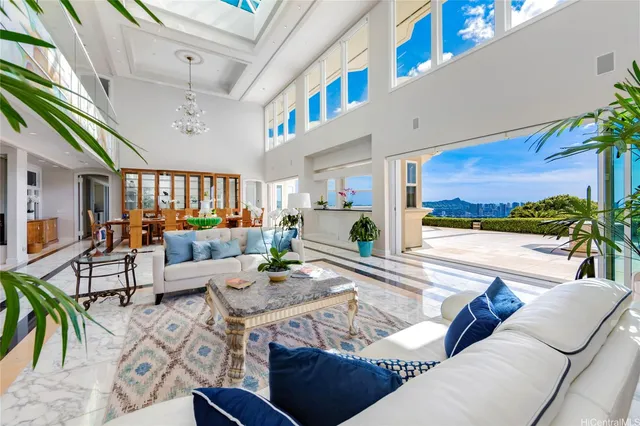 a room with furniture and a view of kitchen