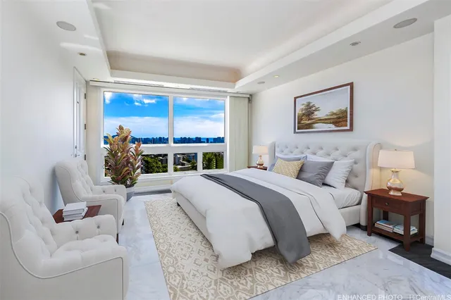 a large white room with a large window and white walls