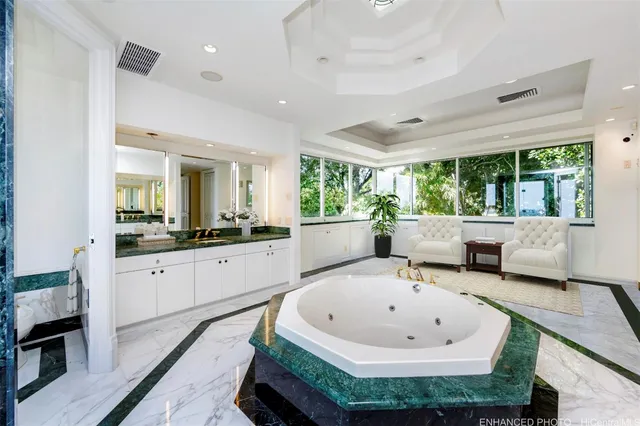 a kitchen with a table chairs and a refrigerator