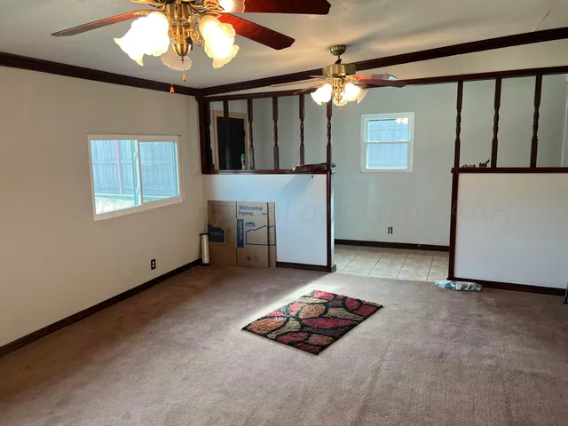 a view of a livingroom with furniture and chandelier