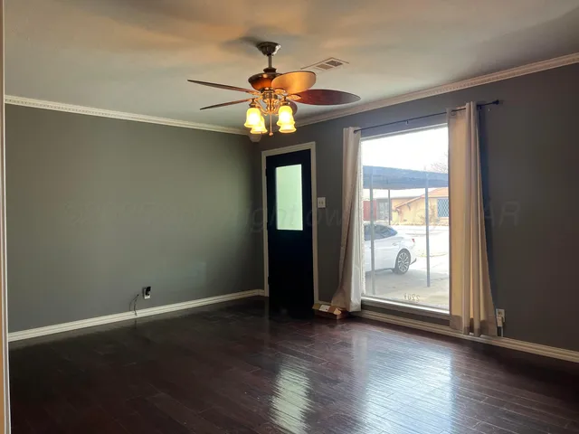 a view of a livingroom with wooden floor