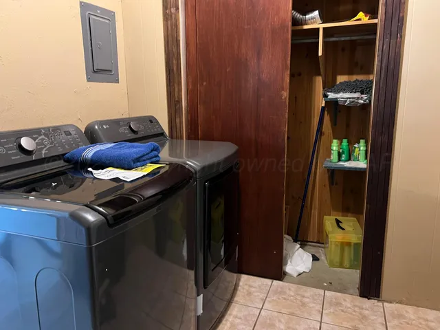 a close view of shoes stand in front of a house