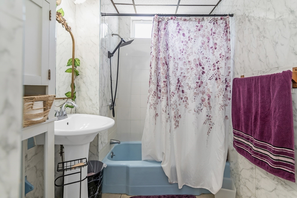 191 Farnham Street Lawrence, MA 01843 - Photo 11 of 31 a bathroom with a sink a toilet and shower