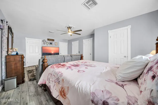 a bed room with a bed and a television