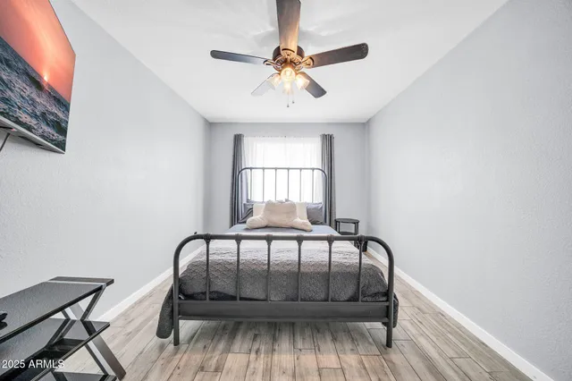 a bedroom with a bed and window