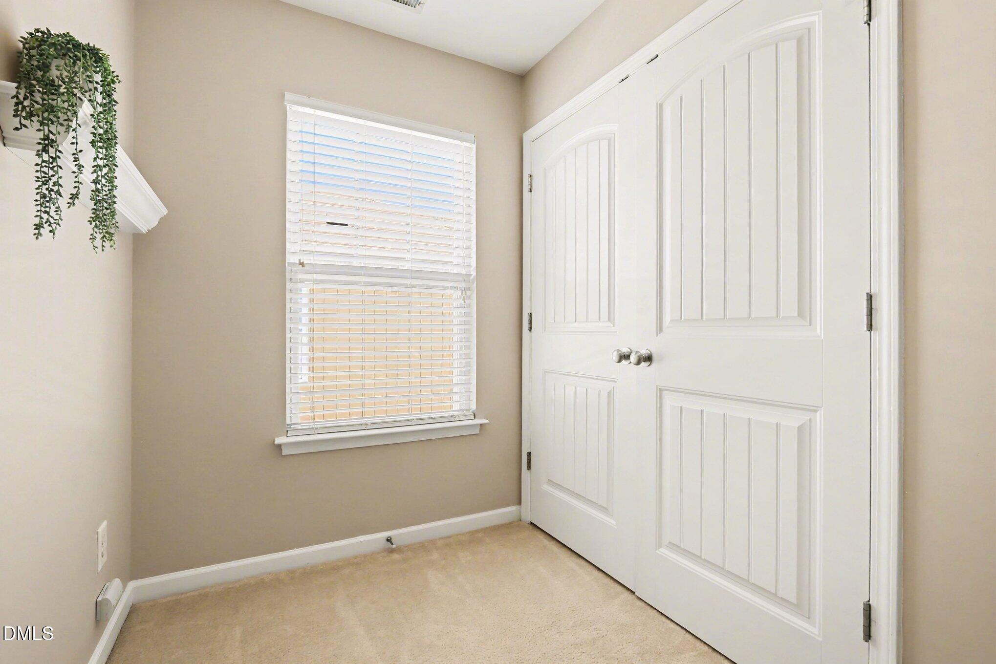 2409 Memory Ridge Drive Raleigh, NC 27606 - Photo 25 of 36 a view of an empty room with a window
