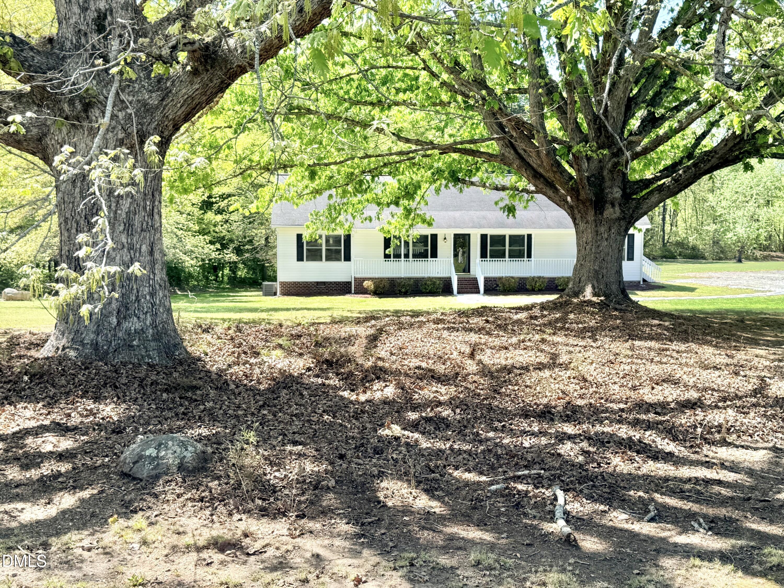 2429 Halifax Road Roxboro, NC 27573 - Photo 1 of 54 a front view of a house with garden