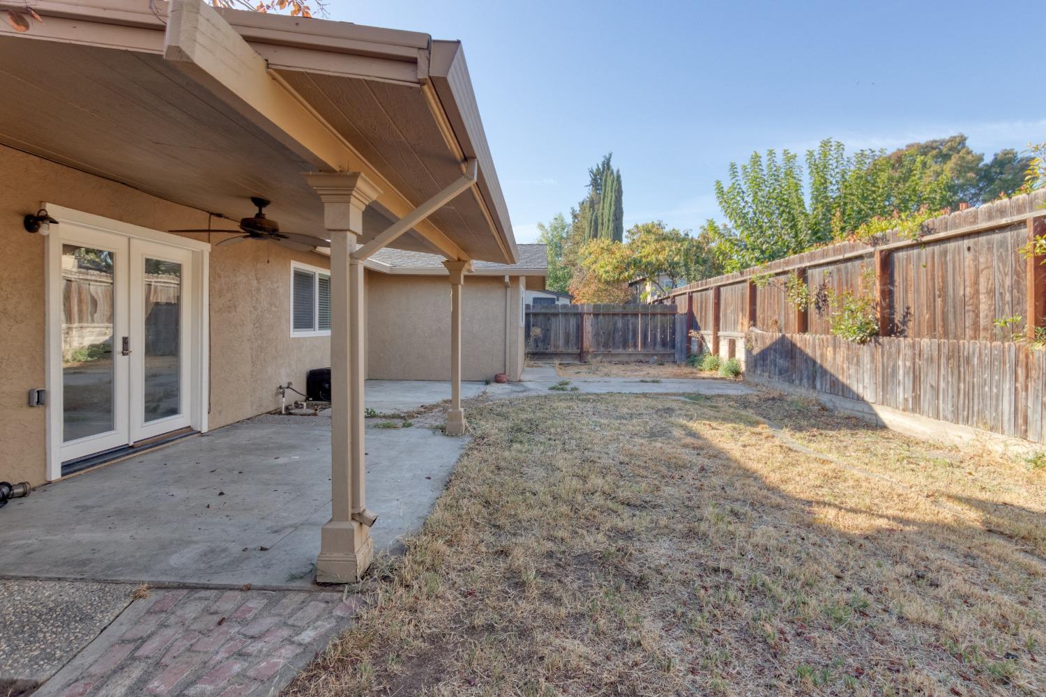725 R Street Newman, CA 95360 - Photo 27 of 31 a view of a house with backyard and roof