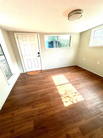 a view of an empty room and window