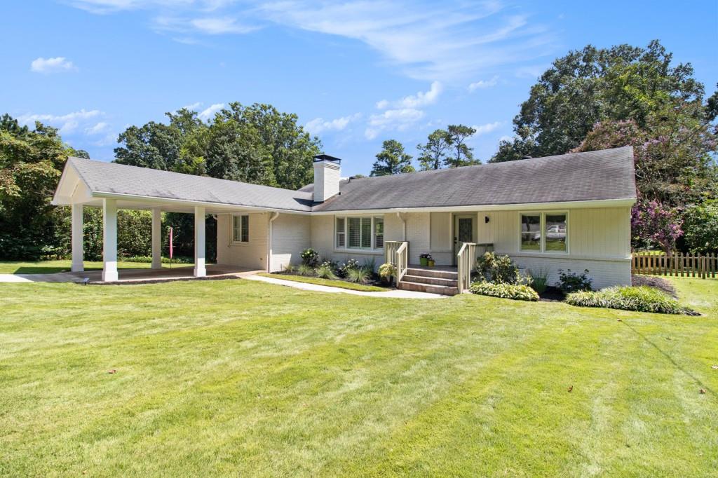 2115 Sylvania Drive Decatur, GA 30033 - Photo 1 of 1 a front view of a house with swimming pool having outdoor seating