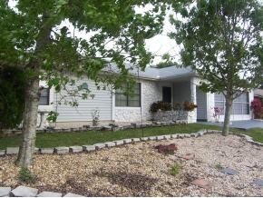 585 Northwest Higgs Palm Bay, FL 32907 - Photo 11 of 12 a front view of a house with a yard and garage