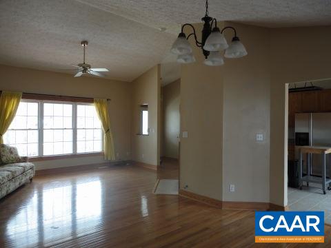26 Brougham Road Palmyra, VA 22963 - Photo 3 of 20 a view of an empty room with wooden floor and a window