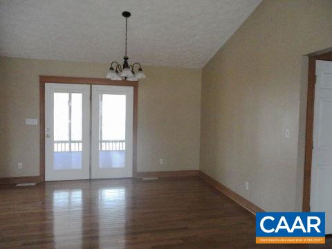 26 Brougham Road Palmyra, VA 22963 - Photo 4 of 20 a view of an empty room with window and wooden floor