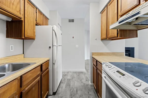 a view of a storage and utility room with washer and dryer