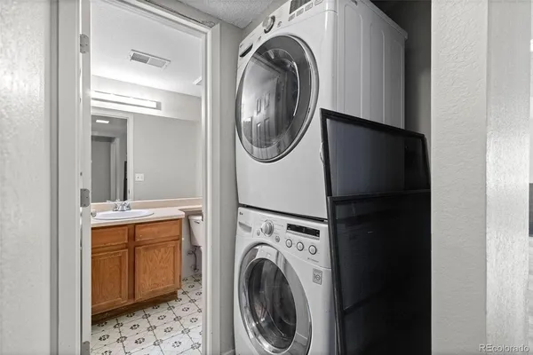 a bathroom with a sink vanity and toilet