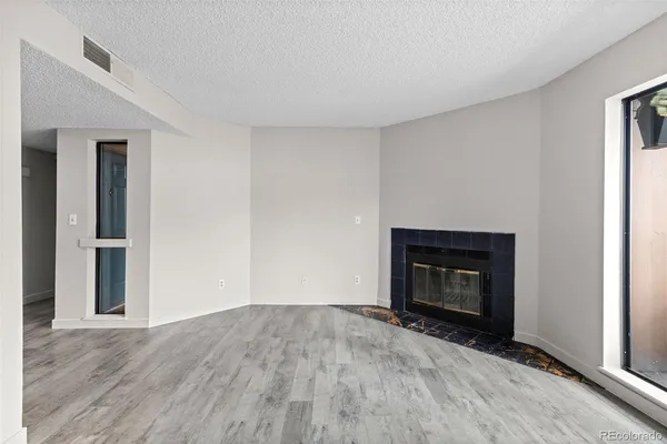 a view of kitchen and wooden floor