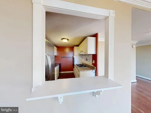 a view of a living room and bathroom